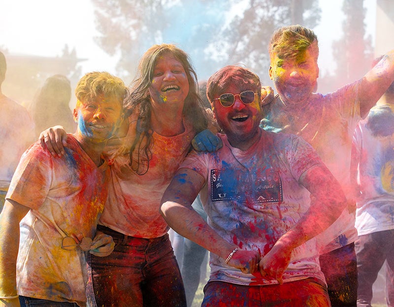 A diverse group of UCR students celebrate UCR's Festival of Color.