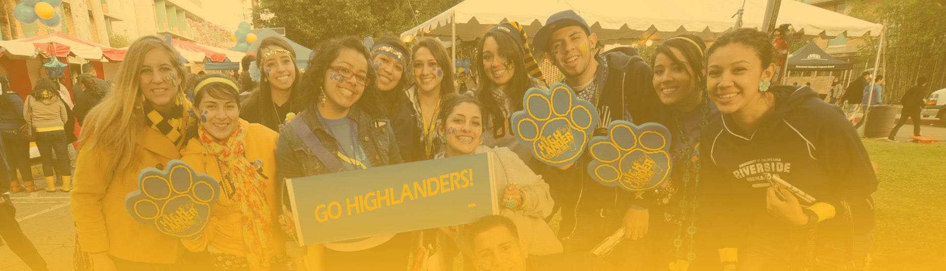 UCR students pose for a group picture during a campus event.