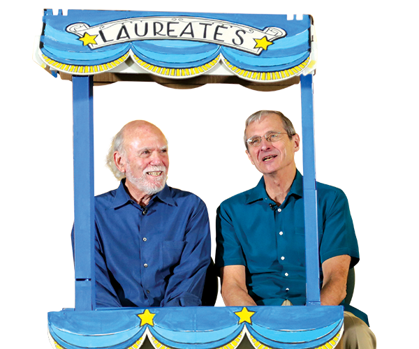 UCR Professors Barry Barish and Richard Schrock wait in a question booth.